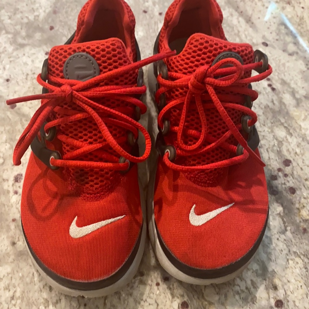 Red Nike hurracha size 1 stain on right shown